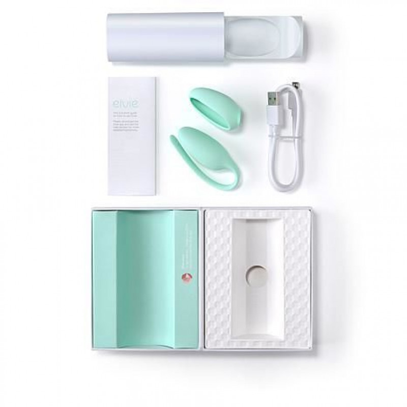 Тренер Кегеля Elvie Exercise Tracker м'ятного кольору в оточенні аксесуарів для демонстрації комплектації