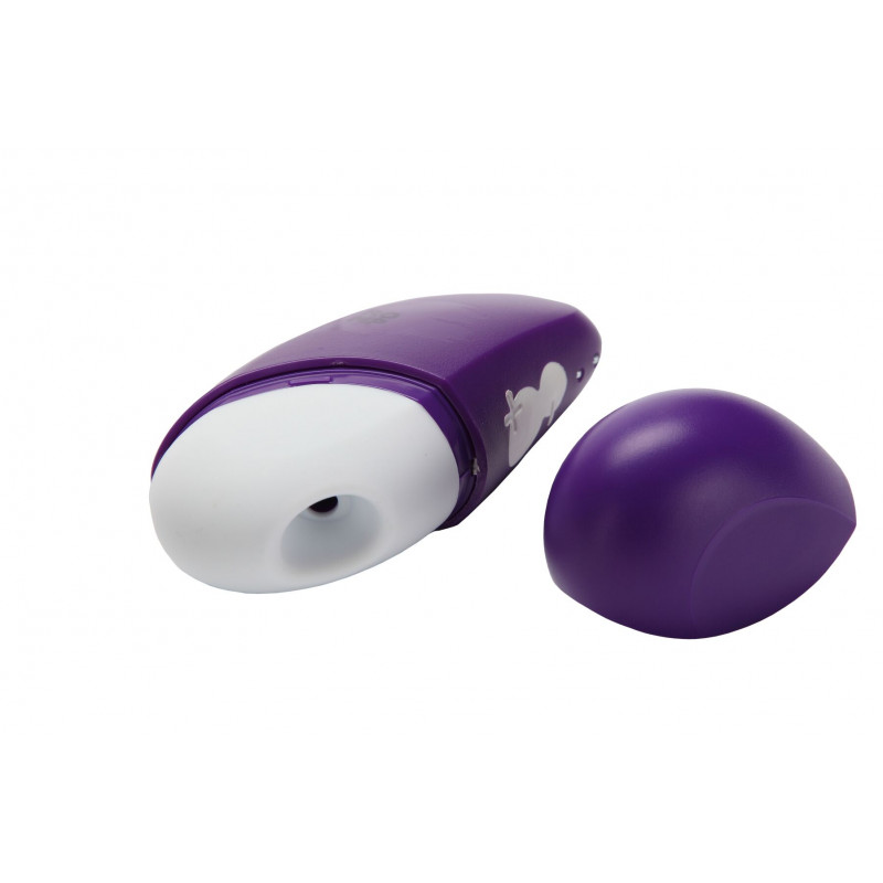 Вакуумний кліторальний стимулятор Romp Free на його зарядній док-станції.