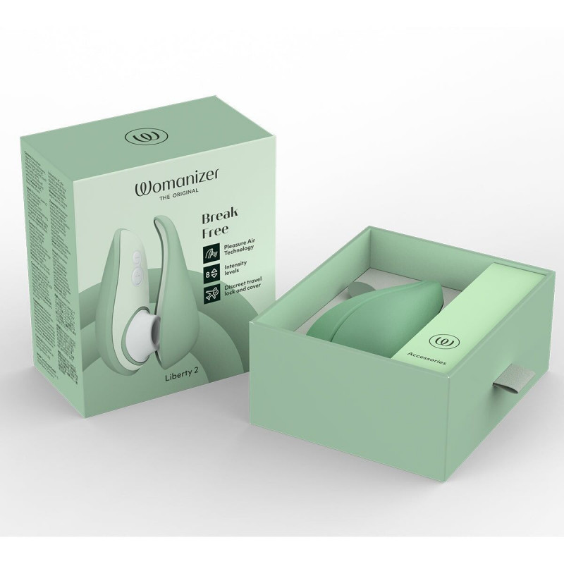 Womanizer Liberty 2 Sage у процесі заряджання, демонструючи його магнітний порт