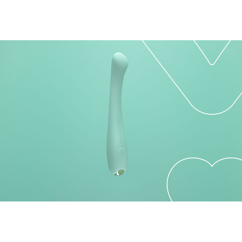 Вібратор FairyGasm MerryWand зелений в руці, демонстрація розміру