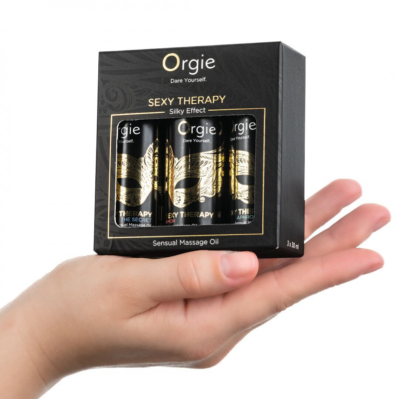 Вигляд збоку набору масажних олій Orgie Sexy Therapy Mini Size Collection, демонструючи витончену упаковку та мініатюрні розміри пляшечок.