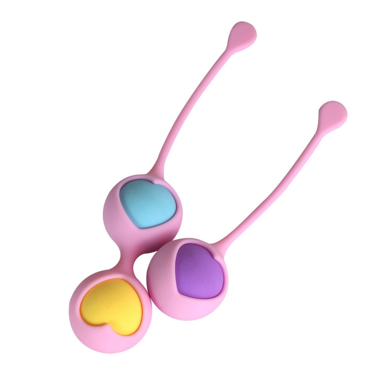 Вид збоку на вагінальні кульки Wooomy Love Pearls, демонструючи їхню гладку текстуру