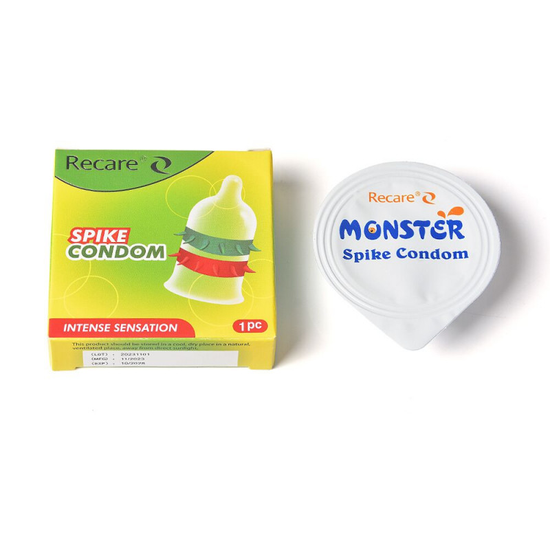 Крупним планом текстура шипів на презервативі Recare Spike Condom Green